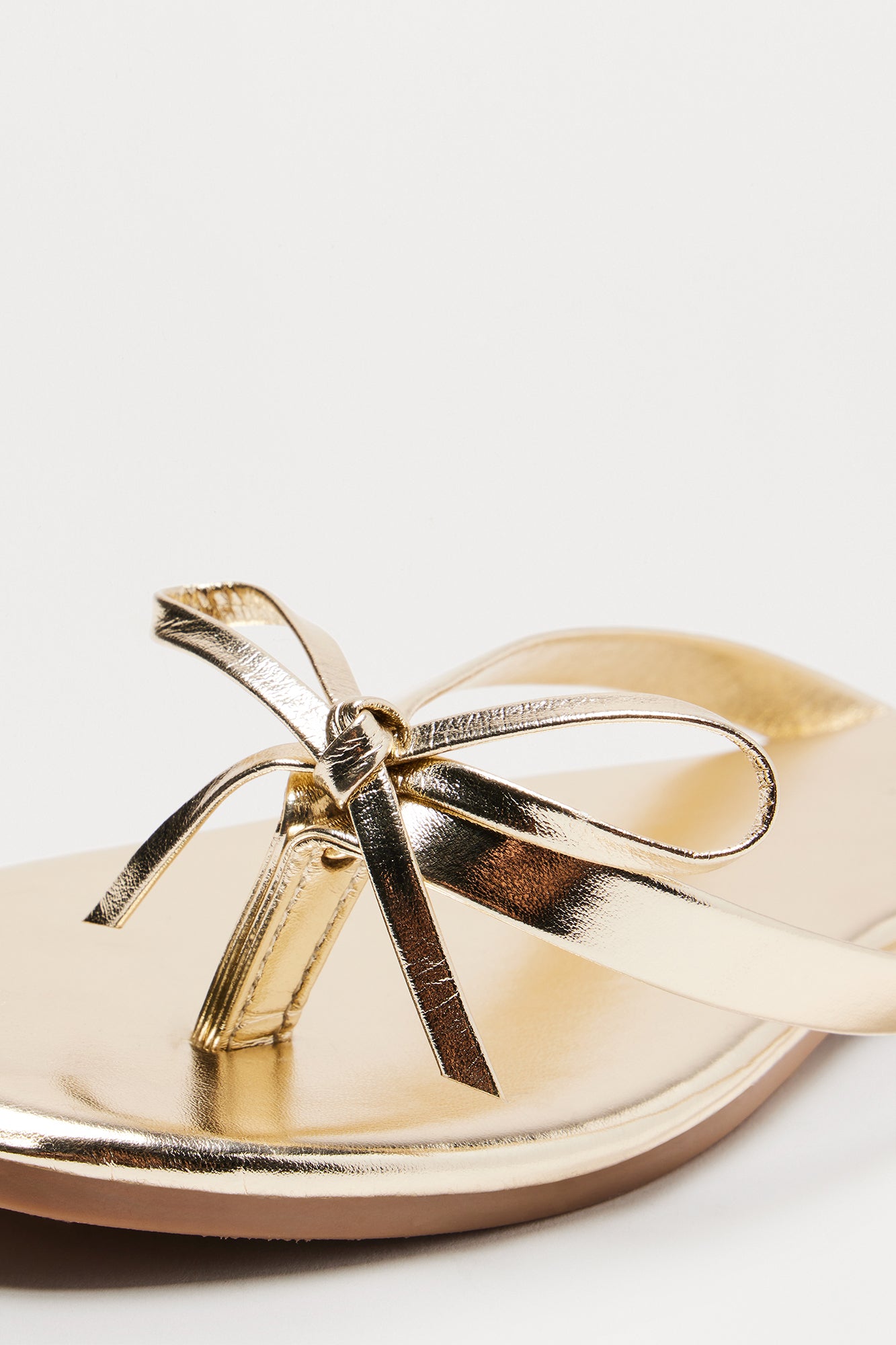 Coral Bow Flip Flops - Gold