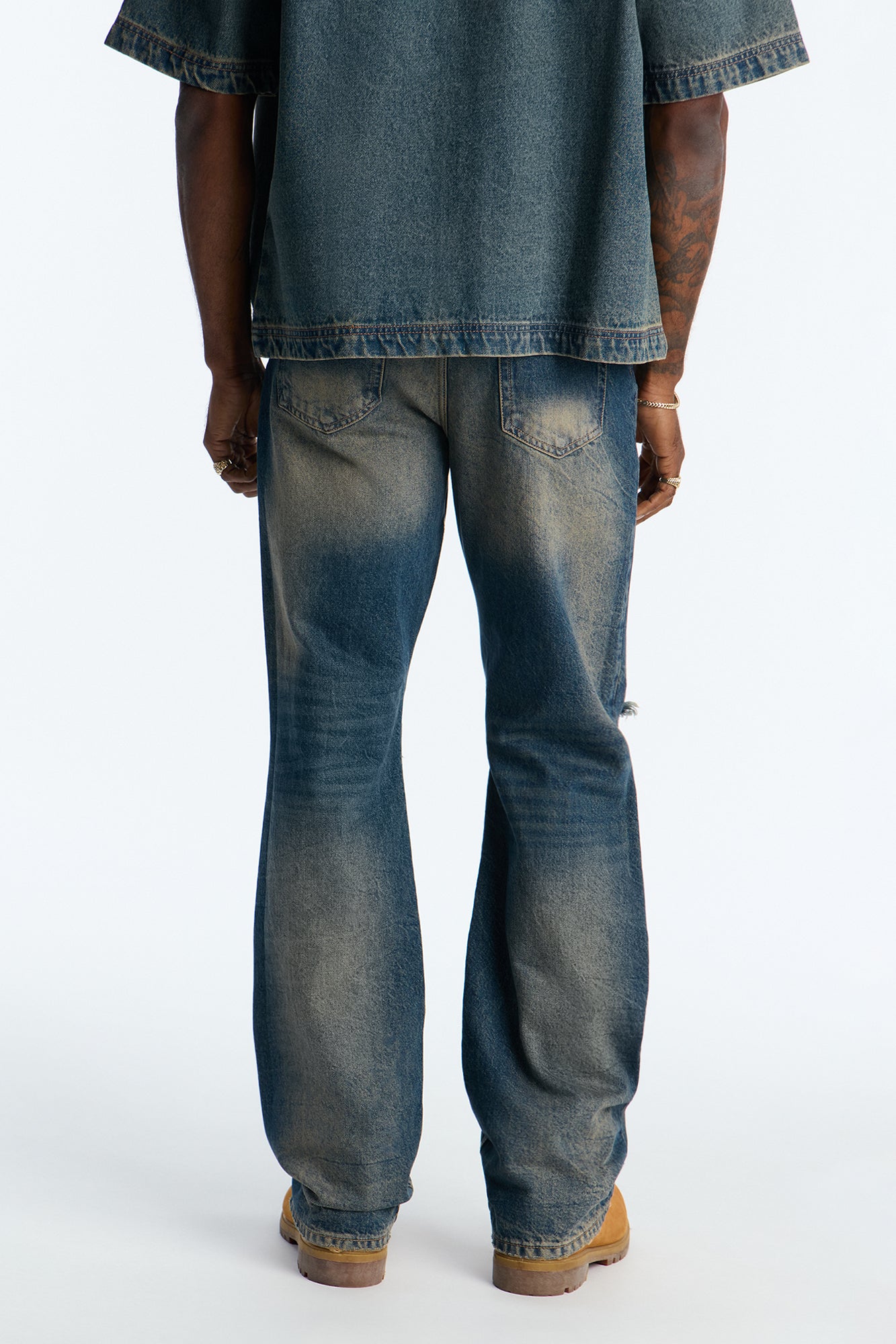 Stacked Slim Flare Looking Out Distressed Grommet Jean - Dark Wash